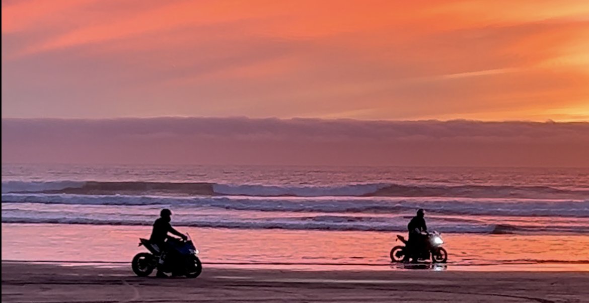 Riders at sunset on the beach